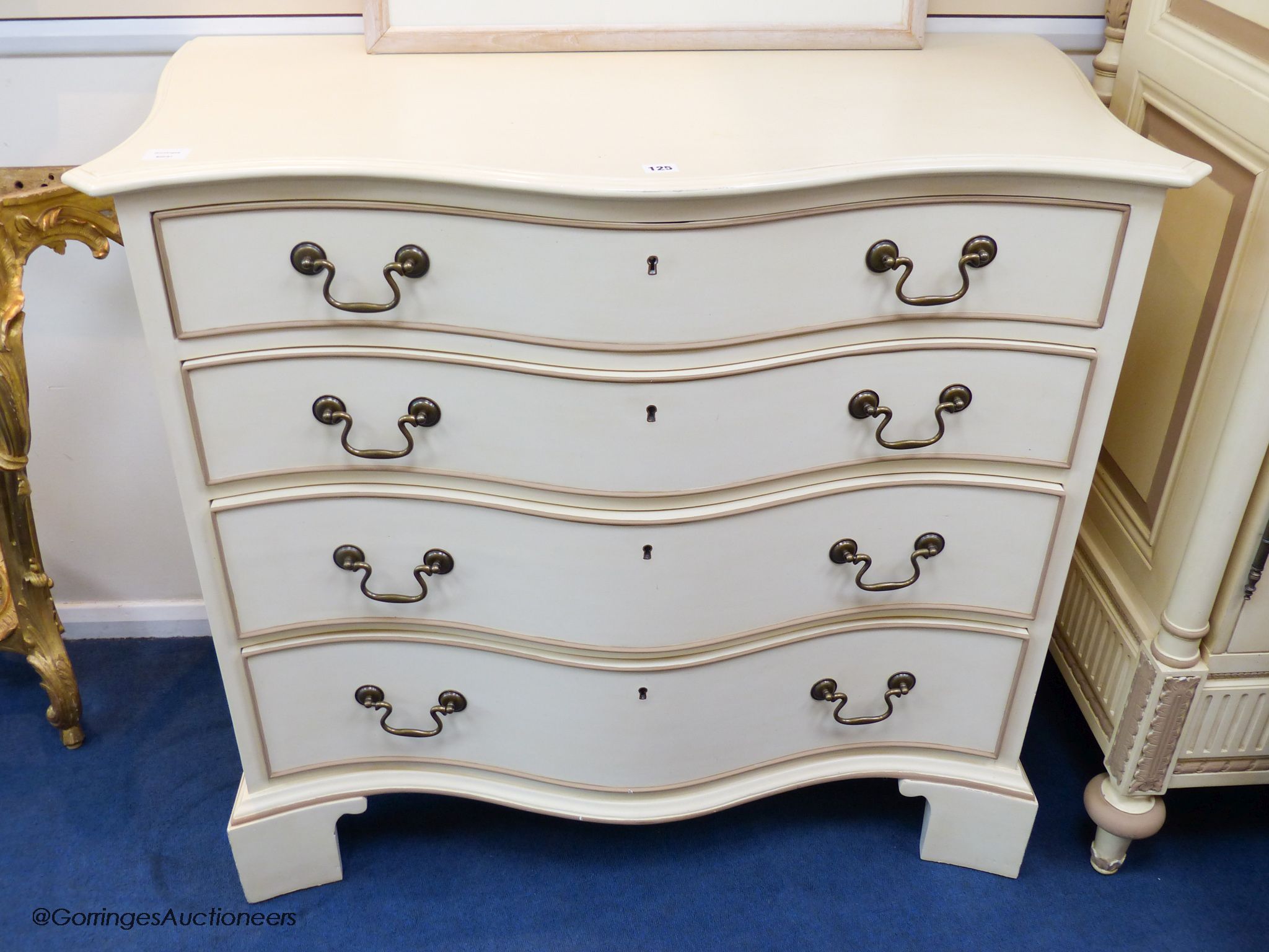 A cream and parcel gilt 'eclectic' chest of drawers by And So To Bed, 106 cm wide, 56 cm deep, 96.5 cm high